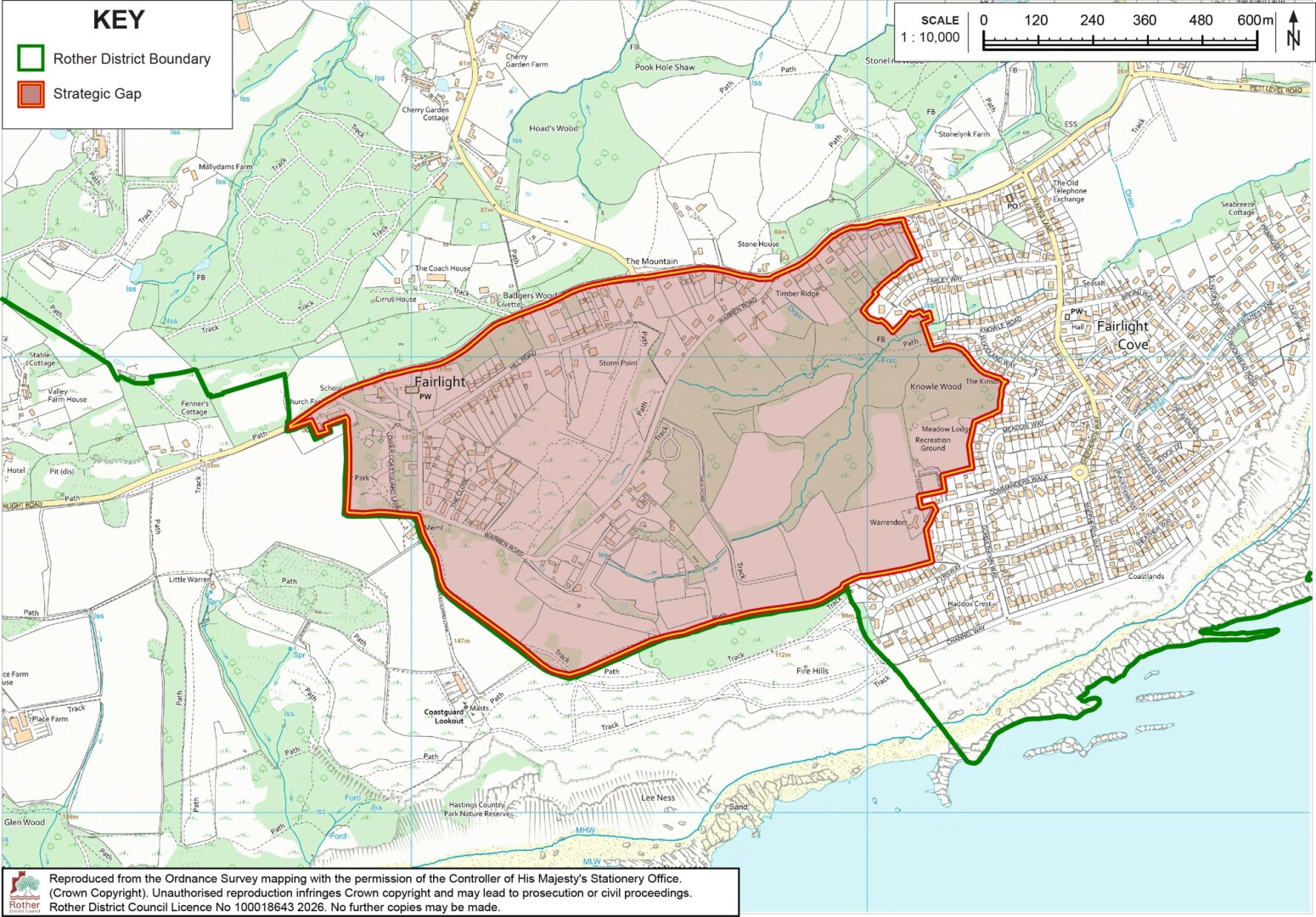 planning map shows Strategic Gap area near Fairlight and Hastings, with shaded region highlighting protected open land. Green line marks Rother District Boundary, while red outline identifies Strategic Gap; roads, settlements, woodland, coastline, and 0–600 m scale provide geographic context.