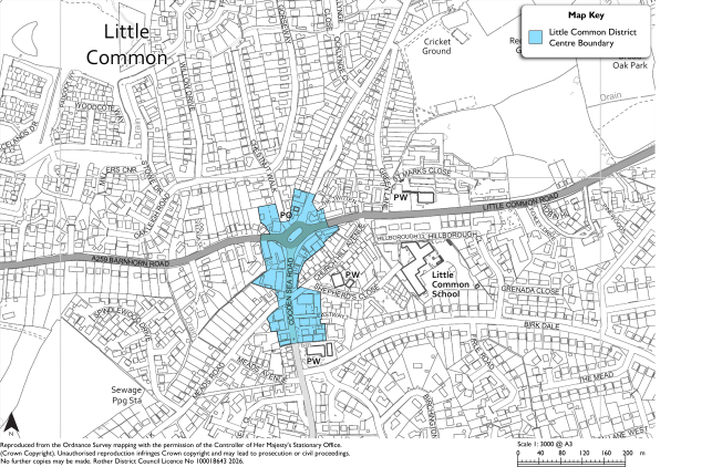 Map showing Little Common District Centre boundary in blue across a developed area of Little Common. Labels identify Little Common School, cricket ground, sewage pumping station, roads, parking, key map, north arrow, and scale bar.
