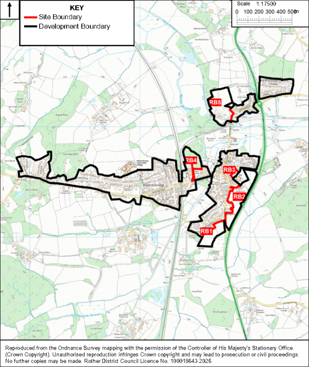 Map showing proposed development areas and site boundaries across Robertsbridge. Red outlines mark site boundaries, black outlines mark development boundaries, labels identify RB1–RB5, and a scale bar provides local geographic reference.


