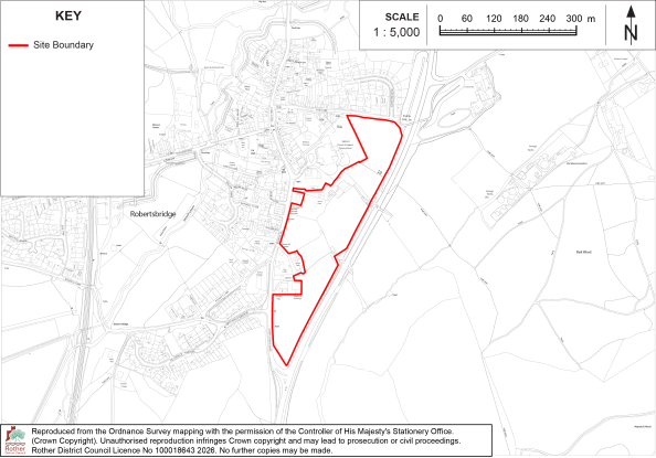 RB2 Site-boundary map showing proposed development area near Robertsbridge, England, overlaid on a detailed base map. Red outline marks a long, irregular parcel; scale bar reaches 300 m, with north arrow and key provided.
