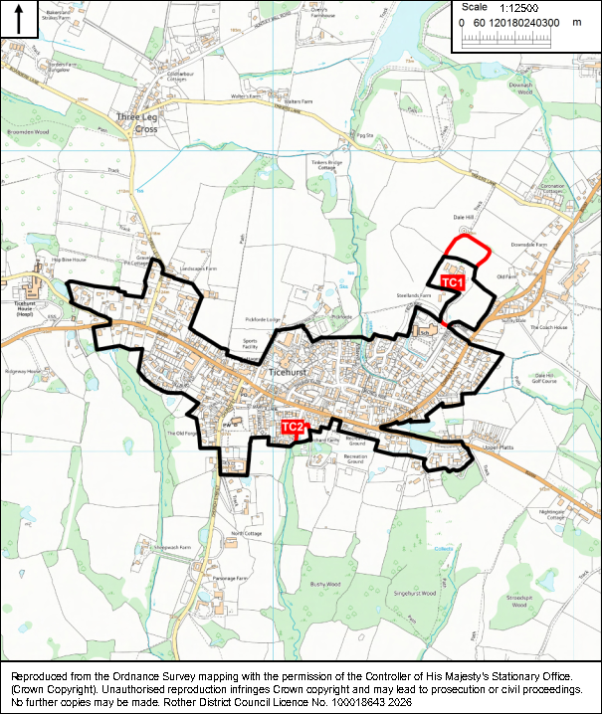 Ordnance Survey map shows Ticehurst and surrounding rural areas, outlining a designated boundary in black. Red markers labeled TC1 and TC2 identify two notable locations, with roads, settlements, waterways, fields, and a 1:12,500 scale bar providing geographic context.
