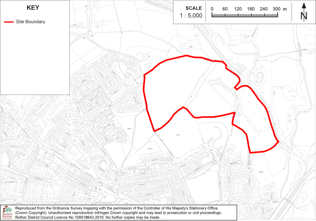 BX32 Site-boundary map showing a large outlined development area within an urban and semi-rural landscape. Red boundary encloses open fields and wooded areas, with surrounding roads and buildings; key includes 1:5,000 scale bar and north arrow.


